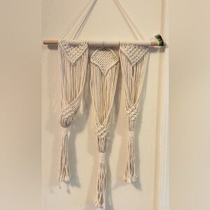 macramé pot hanger. It can hold 3 pots. Wood Rod 17 inches.